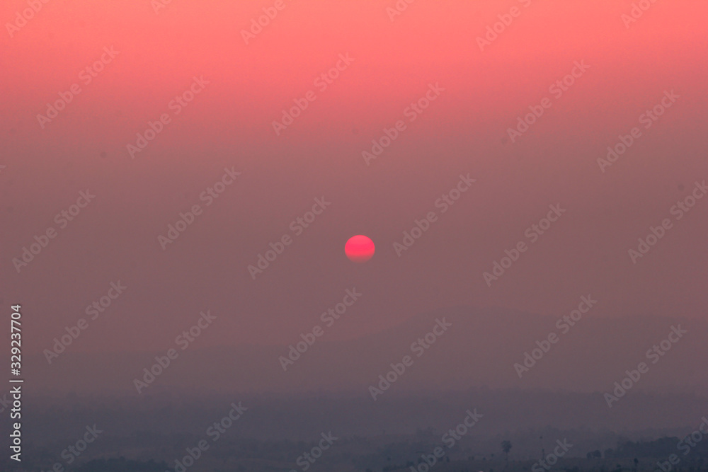 The blurred abstract background of the sun reversing the horizon in the mountains, colorful change over time, the beauty of seasonal nature The blurred abstract background of the sun reversing the horizon in the mountains, colorful change over time, the beauty of seasonal nature