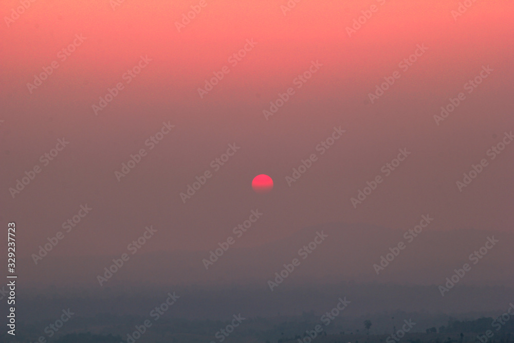 The blurred abstract background of the sun reversing the horizon in the mountains, colorful change over time, the beauty of seasonal nature