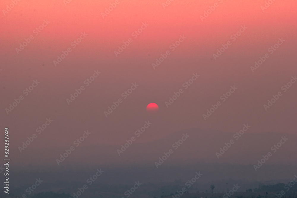 The blurred abstract background of the sun reversing the horizon in the mountains, colorful change over time, the beauty of seasonal nature The blurred abstract background of the sun reversing the horizon in the mountains, colorful change over time, the beauty of seasonal nature
