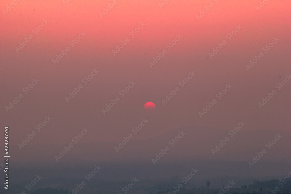The blurred abstract background of the sun reversing the horizon in the mountains, colorful change over time, the beauty of seasonal nature