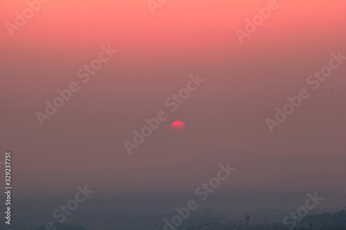 The blurred abstract background of the sun reversing the horizon in the mountains, colorful change over time, the beauty of seasonal nature