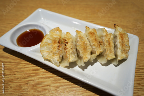 Close up Gyoza, Japanese wonton wrappers stuffed with minced pork and cabbage served with dipping soy sauce
