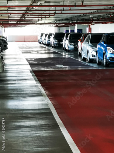Many car in car parking garage/building : concept of eco world, traffic , city and  office © Panithan