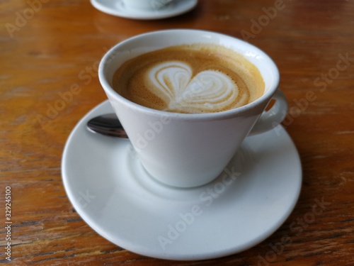 cup of coffee on wooden table