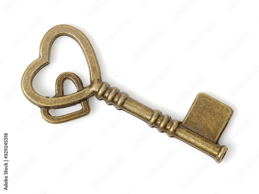 old brass key against a white background old brass key against a white background