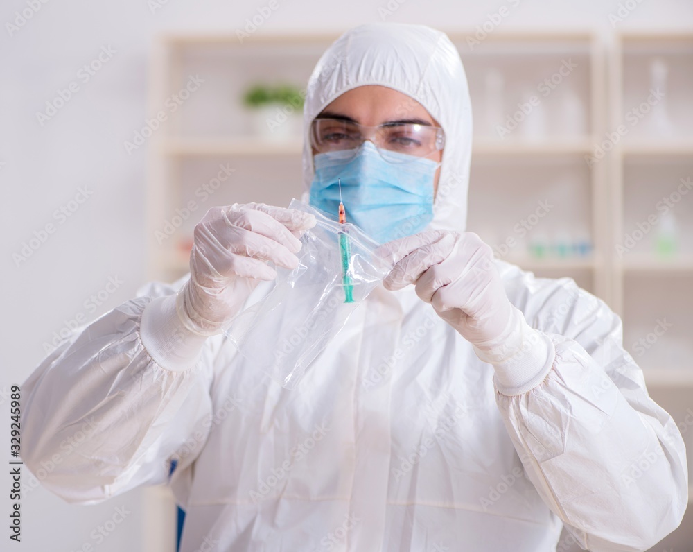 Expert criminologist working in the lab for evidence Expert criminologist working in the lab for evidence