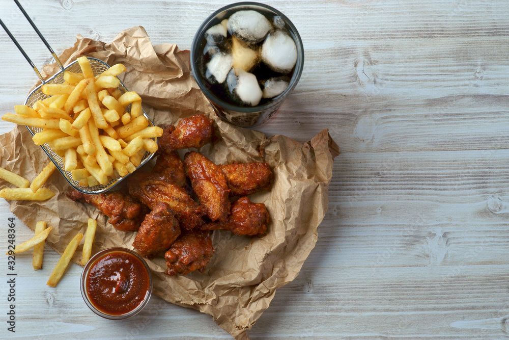 grilled BBQ wings with French fries and Cola grilled BBQ wings with French fries and Cola