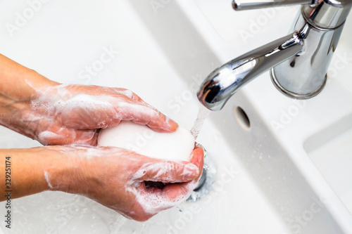 Washing hands with soap for coronavirus prevention, hygiene to stop spreading coronavirus.