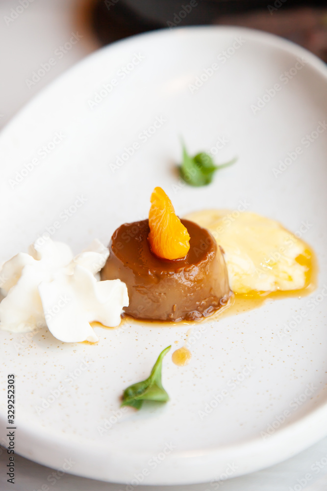 Coffee pudding served with whipped cream and passion fruit mousse Coffee pudding served with whipped cream and passion fruit mousse
