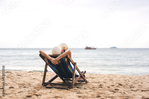 Young Asian woman relax at the sea beach.