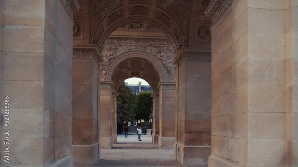 Young tourist walking at the arch in Paris Young tourist walking at the arch in Paris
