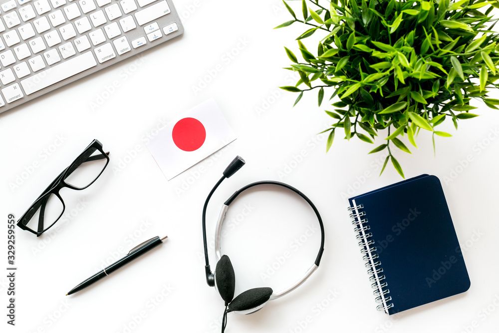 Learn Japanese online. Concept with flag, headset and keyboard on white background top-down - obrazy, fototapety, plakaty 