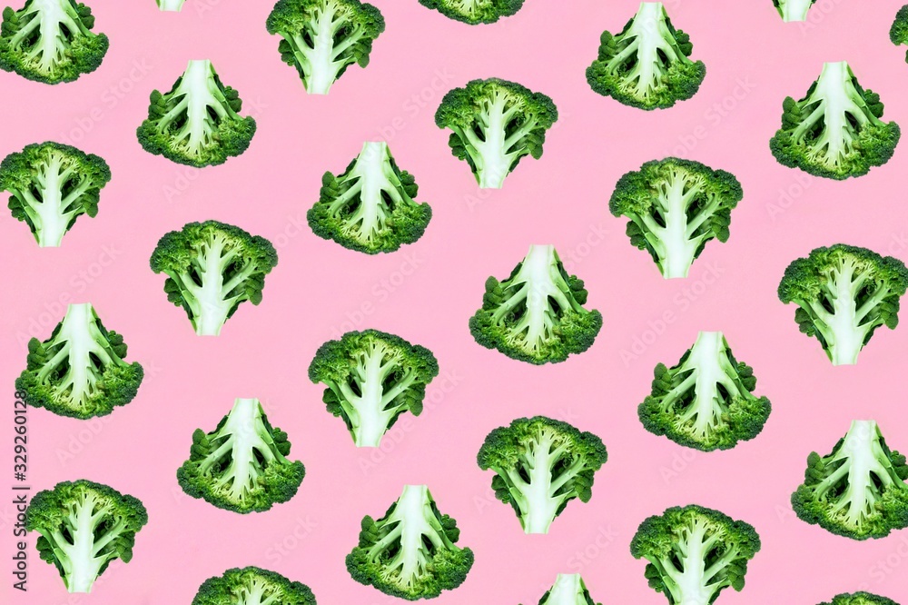 Seamless minimalistic pattern with broccoli on a pink background. Photo collage, vegan pop art design, vegetable backdrop, diet, healthy food. Postcard, print on fabric, wrapping paper. Top view. Seamless minimalistic pattern with broccoli on a pink background. Photo collage, vegan pop art design, vegetable backdrop, diet, healthy food. Postcard, print on fabric, wrapping paper. Top view.
