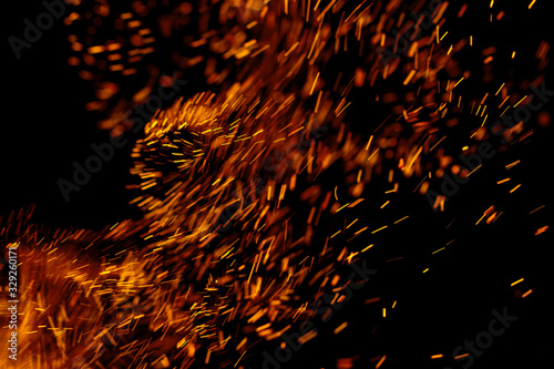 flame of fire with sparks on a black background