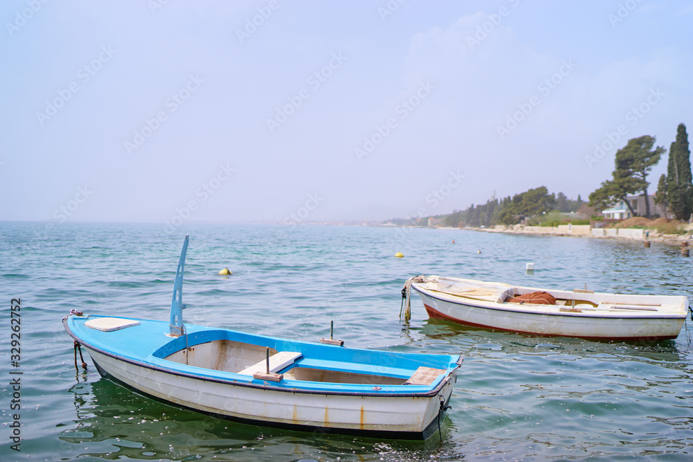 Beautiful landscape with seashore and fishing boat.