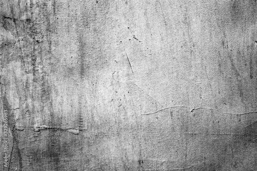 Obraz premium Texture of a concrete wall with cracks and scratches which can be used as a background