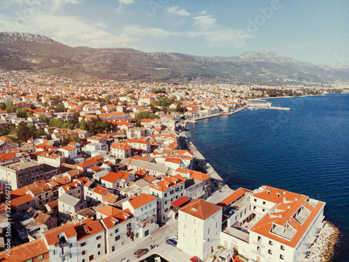Aerial shot of the Kastel coast in Dalmatia,Croatia . A famous tourist destination on the Adriatic sea. Old town near the mountains.