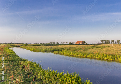 Little river in the landscape of Groningen province, Netherlands