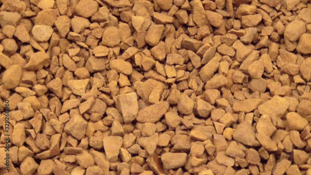 Macro view of Instant granulated coffee. Top view and Video rotation