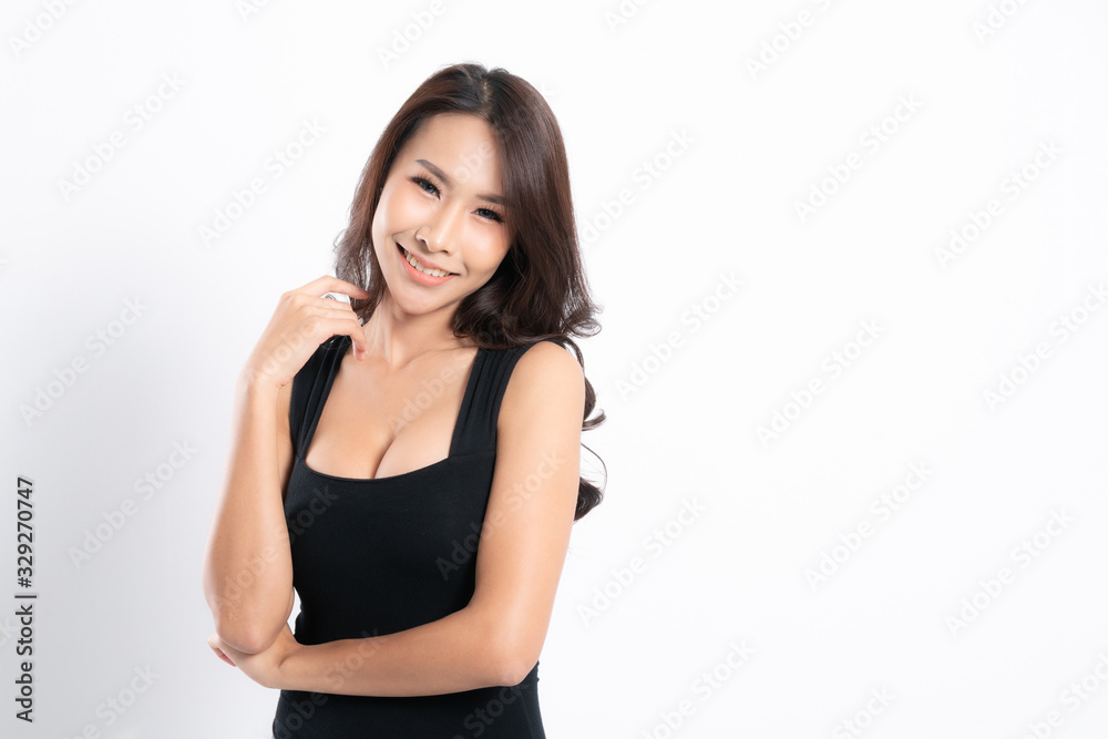 Asian woman portrait with perfect skin and wearing a black shirt in profile at studio shot isolated on white background. Asian woman portrait with perfect skin and wearing a black shirt in profile at studio shot isolated on white background.