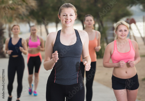 Smiling young girls during racewalking training