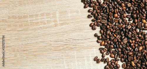 Banner of coffee beans on wooden background