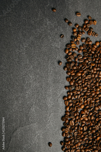 Ardesia dark background with coffee beans on the sides