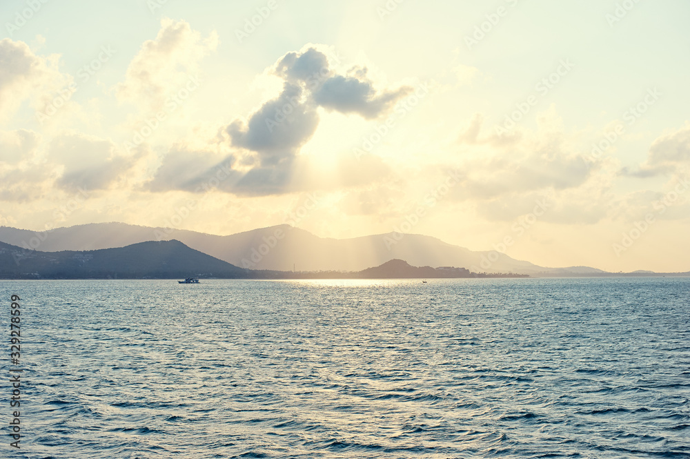 Sea and sunset. Beautiful seascape with sun shining thrue clouds. Sea and sunset. Beautiful seascape with sun shining thrue clouds.