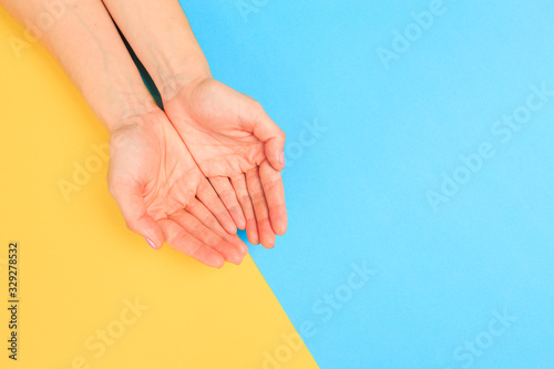 female  manicure. Beautiful young woman s hands on pastel color  background - Image