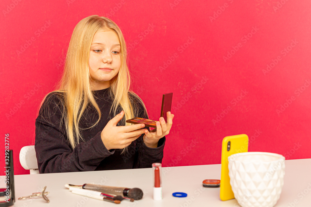 Cute little beauty blogger. Girl speaking in front of camera for vlog. Young black woman working as blogger, recording video tutorial for Internet