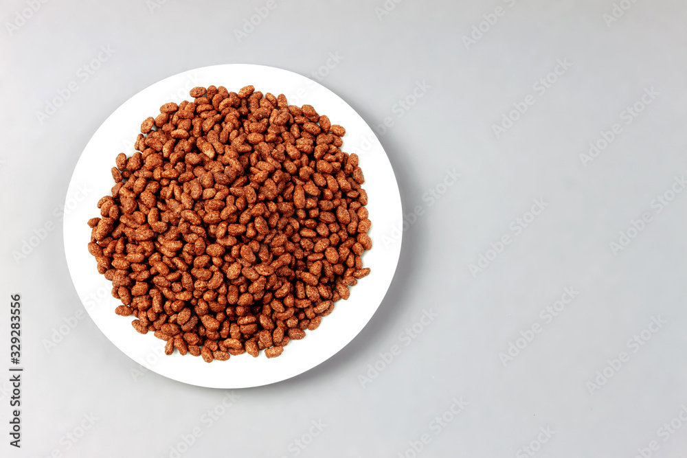 Breakfast with chocolate rice on gray background, top view. Space for text Breakfast with chocolate rice on gray background, top view. Space for text
