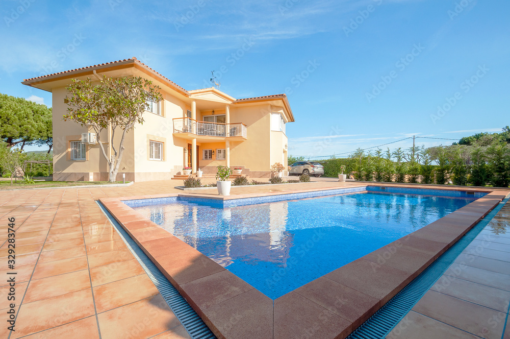 Fototapeta premium Classic new home with pool. Real estate Luxury exterior design pool villa