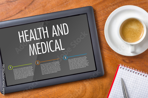 Tablet on a wooden desk - Health and Medical