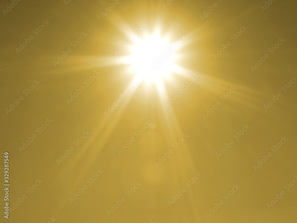 Summer shining sun at clear yellow sky. Abstract spring background with sunrise and lighting effects. White day sun with rays and glow on a yellow backdrop.