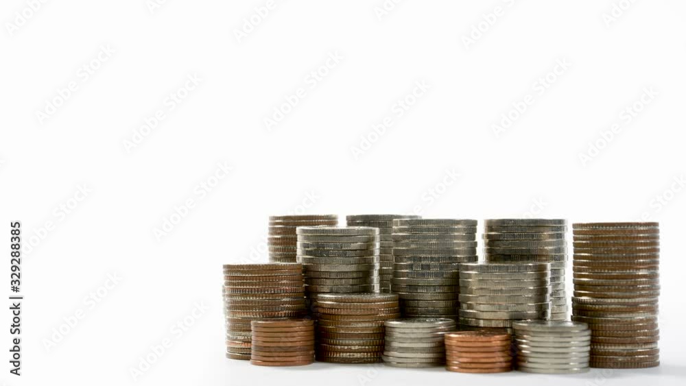 Coins on stack on white background - stop motion . Coins on stack on white background - stop motion .