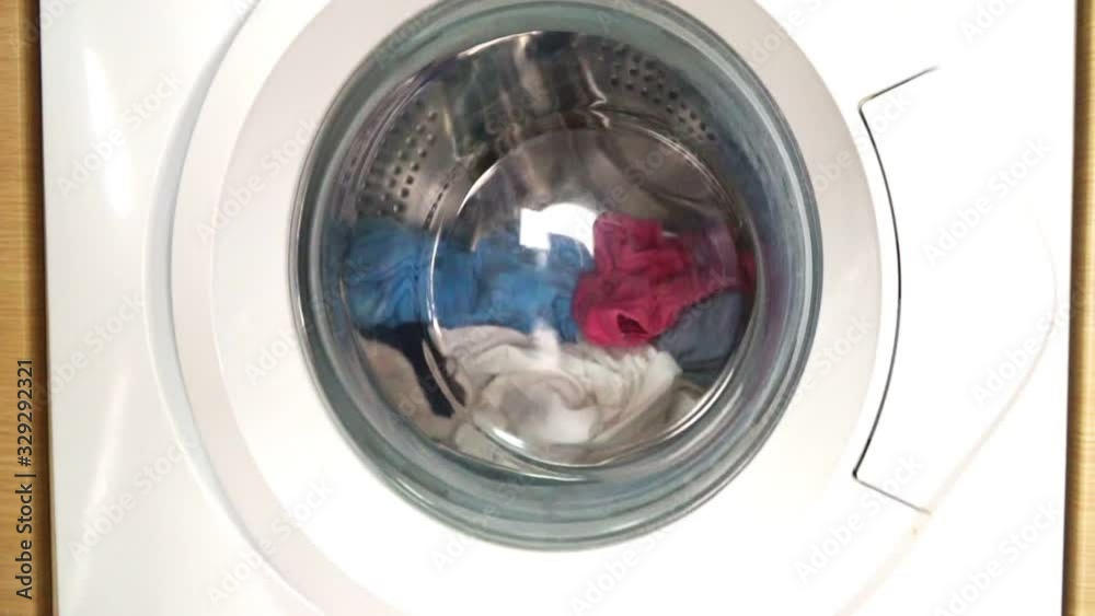 Washing machine with clothes opening door. Washing machine with clothes opening door.