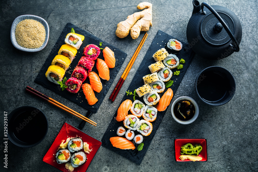 apanese sushi food. Maki ands rolls with tuna, salmon, shrimp, crab and avocado. Top view of assorted sushi. Rainbow sushi roll, uramaki, hosomaki and nigiri apanese sushi food. Maki ands rolls with tuna, salmon, shrimp, crab and avocado. Top view of assorted sushi. Rainbow sushi roll, uramaki, hosomaki and nigiri