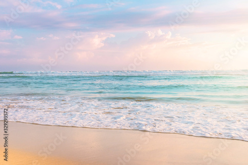 Blue ocean coast and beautiful cloudy sky. Fantastic seascape in soft pastel colors. Honeymoon and travel concept photo.