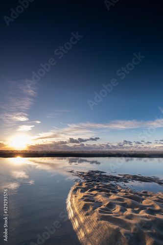 Tranquil colorful sunset over sea  viewed from the dutch coast. The Netherlands