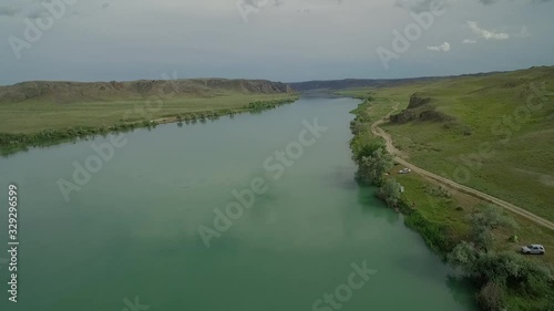 landscape with river and flying over the water 