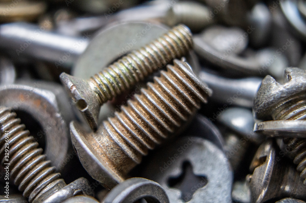 Metal hardware bolts and nails close-up. Macro photography Metal hardware bolts and nails close-up. Macro photography