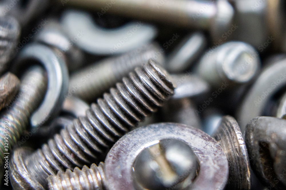 Metal hardware bolts and nails close-up. Macro photography Metal hardware bolts and nails close-up. Macro photography