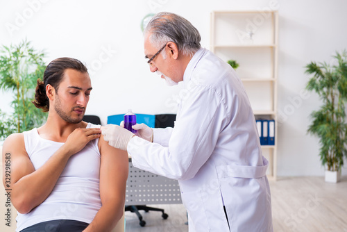 Young male patient visiting experienced doctor © Elnur