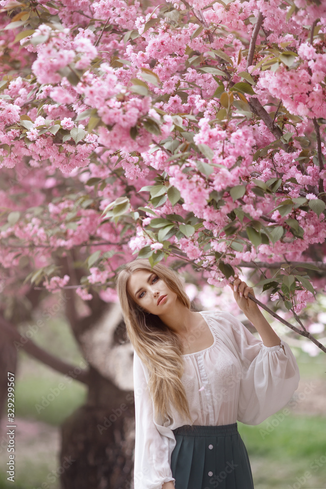 Woman at Blossoming Sakura Tree on Nature