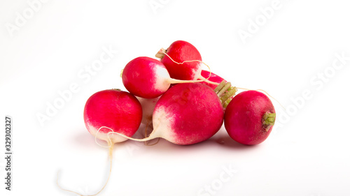 Eco clean root vegetable. Radishes on white background