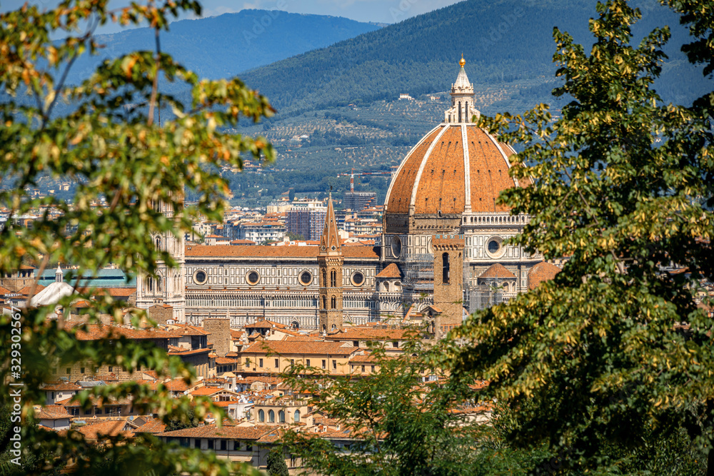Beautiful distant view of the Cathedral of Florence in hot summer day. Travel destination Tuscany, Italy