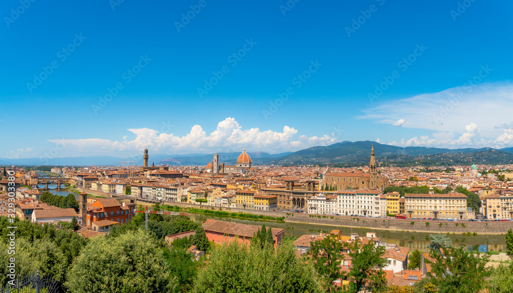 Beautiful panorama view of the city of Florence with bridges over Arno river in hot summer day. Travel destination Tuscany, Italy