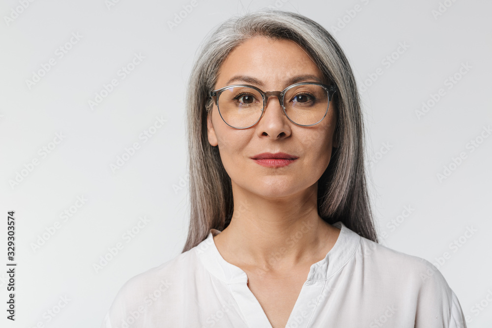 Fototapeta premium Image of adult mature woman wearing eyeglasses and office clothes