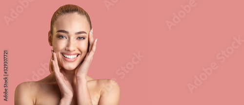 Girl With Nude Makeup Standing Over Pink Studio Background
