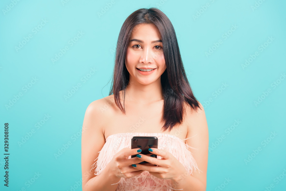 Portrait asian beautiful woman her typing message and smiling Portrait asian beautiful woman her typing message and smiling